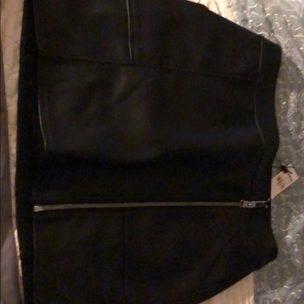 A black zip ups leather skirt